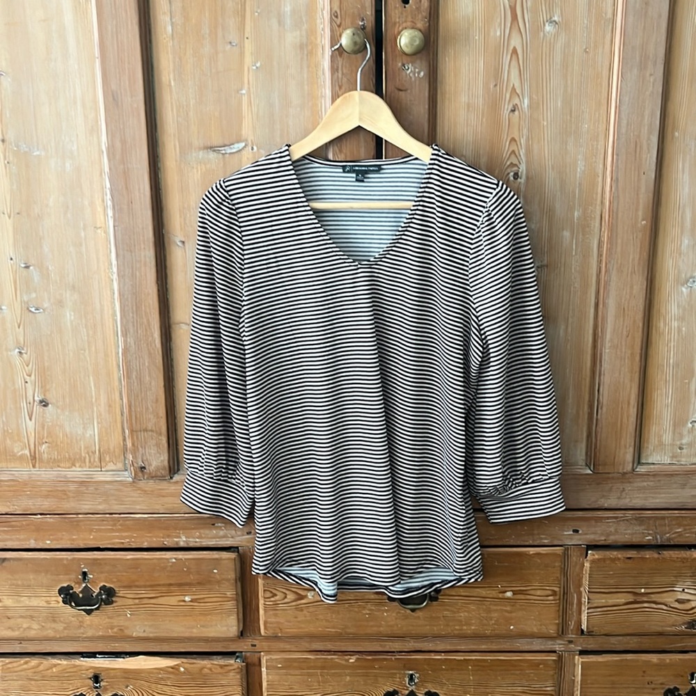 Adrianna Panell top in black and tan strip with balloon sleeves.